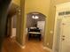Welcoming entryway with hardwood floors, elegant chandelier, and arched doorways adding charm at 1162 Mason Lee, Loganville, GA 30052