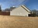 Exterior view of home showing siding, windows, and a wood fence at 1162 Mason Lee, Loganville, GA 30052