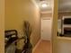 Hallway with crown molding and neutral colored walls and wood floors at 1162 Mason Lee, Loganville, GA 30052