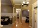 Hallway with hardwood floors and neutral color palette, connecting various living spaces within the home at 1162 Mason Lee, Loganville, GA 30052