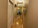 Well-lit hallway with gleaming hardwood floors and decorative mirror at 1162 Mason Lee, Loganville, GA 30052