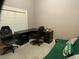 Well-lit home office featuring an executive desk setup and comfortable seating for a productive workspace at 1162 Mason Lee, Loganville, GA 30052
