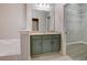 Bathroom boasts green vanity with tub and open walk-in closet with wire shelving at 1910 Cedar Glenn Way # 4401, Atlanta, GA 30339
