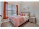 Cozy bedroom features a double bed, picture window, and light gray bedside tables at 1910 Cedar Glenn Way # 4401, Atlanta, GA 30339