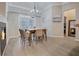 Bright dining room with large doors leading to outdoor area next to fireplace at 1910 Cedar Glenn Way # 4401, Atlanta, GA 30339