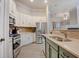 Spacious kitchen with stainless steel appliances, ample cabinet space, and a view into the adjacent living area at 1910 Cedar Glenn Way # 4401, Atlanta, GA 30339