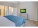 Serene main bedroom with TV, dresser and ensuite bathroom access at 1910 Cedar Glenn Way # 4401, Atlanta, GA 30339