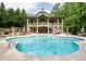 A luxurious community pool surrounded by lush landscaping and resort-style amenities at 1910 Cedar Glenn Way # 4401, Atlanta, GA 30339
