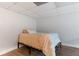 The basement space features a bed, drop ceiling, and vinyl floors at 23 Peggy Nw Ct, Marietta, GA 30064
