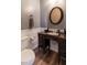 Charming bathroom features a vintage-style vanity with ample storage and stylish fixtures at 23 Peggy Nw Ct, Marietta, GA 30064