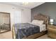 Bedroom with tufted headboard bed, ornate gold mirror, and modern two-tone paint at 23 Peggy Nw Ct, Marietta, GA 30064