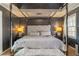 This bedroom features a modern four-post bed with a padded headboard at 23 Peggy Nw Ct, Marietta, GA 30064