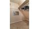 The closet is a unique attic-style space with carpet, clothing rod, and a mirror at 23 Peggy Nw Ct, Marietta, GA 30064