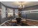 Bright dining room featuring a glass-top table with stylish chairs, enhanced by decorative lighting and trim at 23 Peggy Nw Ct, Marietta, GA 30064