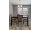 Formal dining room with a dark wood table, comfortable chairs, and natural light at 23 Peggy Nw Ct, Marietta, GA 30064