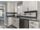 Well-lit kitchen with white cabinetry, granite countertops, and stainless steel appliances at 23 Peggy Nw Ct, Marietta, GA 30064