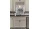 Close-up of the kitchen sink area with granite countertops and ample natural light at 23 Peggy Nw Ct, Marietta, GA 30064