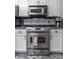 Modern kitchen stove with stainless steel appliances and ample counter space at 23 Peggy Nw Ct, Marietta, GA 30064