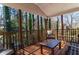 Relaxing covered porch with comfortable seating and a beautiful wooded view at 23 Peggy Nw Ct, Marietta, GA 30064