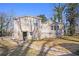 Exterior view of the back of this two-story home with a spacious yard and lots of natural light at 495 Hutchens Se Rd, Atlanta, GA 30354