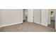 Spacious bedroom with neutral carpet, fresh paint and multiple doorways offering versatile access at 495 Hutchens Se Rd, Atlanta, GA 30354