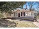 Charming single-story home with neutral siding, black shutters, and well-maintained front lawn at 495 Hutchens Se Rd, Atlanta, GA 30354