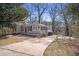 Inviting home features a long driveway, classic design, and peaceful surroundings at 495 Hutchens Se Rd, Atlanta, GA 30354