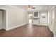 Bright living room with hardwood floors, a decorative fireplace, and french doors to the outside at 495 Hutchens Se Rd, Atlanta, GA 30354