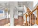 Grand foyer with hardwood floors, soaring ceilings, and a staircase with wood railings at 720 Goldenrod Way, Norcross, GA 30093