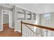 Upstairs hallway with wood floors and architectural details at 720 Goldenrod Way, Norcross, GA 30093