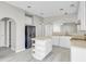 Eat-in kitchen with white cabinets, an island and modern appliances at 720 Goldenrod Way, Norcross, GA 30093