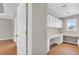 Functional home office with built-in cabinets and a spacious desk area at 720 Goldenrod Way, Norcross, GA 30093