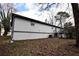 Rear exterior showcasing the home's siding, back deck, and basement foundation at 184 Brandywine Dr, Douglasville, GA 30134