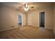 Spacious bedroom with ceiling fan and neutral carpeting at 184 Brandywine Dr, Douglasville, GA 30134