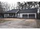 Well-maintained single-story home featuring a two-car garage and a covered front porch at 184 Brandywine Dr, Douglasville, GA 30134