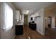 Bright kitchen with white cabinets and stainless steel appliances at 184 Brandywine Dr, Douglasville, GA 30134