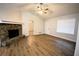 Open concept living room with stone fireplace, hardwood flooring, and vaulted ceilings at 184 Brandywine Dr, Douglasville, GA 30134