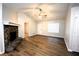 Open concept living room with stone fireplace, hardwood flooring and vaulted ceilings at 184 Brandywine Dr, Douglasville, GA 30134