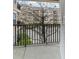 Building view from balcony with black metal railing, and view of courtyard and trees at 1850 Cotillion Dr # 3222, Atlanta, GA 30338