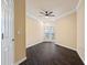 Bedroom featuring wood floors, ceiling fan, and a door to the balcony at 1850 Cotillion Dr # 3222, Atlanta, GA 30338