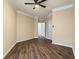Open bedroom featuring hardwood floors, ceiling fan, and two large closets at 1850 Cotillion Dr # 3222, Atlanta, GA 30338