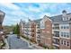 Upscale condominium exterior featuring a brick facade, multiple balconies, and well-maintained landscaping at 1850 Cotillion Dr # 3222, Atlanta, GA 30338