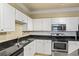 Kitchen with stainless steel appliances, granite countertops, and white backsplash tile at 1850 Cotillion Dr # 3222, Atlanta, GA 30338
