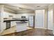 Bright kitchen featuring stainless steel appliances, granite counters, tile floors and a center island at 1850 Cotillion Dr # 3222, Atlanta, GA 30338