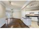 Spacious living room with hardwood floors, ceiling fan, and a doorway to a covered balcony at 1850 Cotillion Dr # 3222, Atlanta, GA 30338