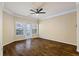 Light-filled living area with hardwood floors, ceiling fan, and balcony access at 1850 Cotillion Dr # 3222, Atlanta, GA 30338
