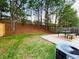 Large backyard featuring a patio with outdoor dining at 3466 Carriage Chase Rd, Atlanta, GA 30349