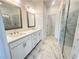Beautiful bathroom with double sink vanity, marble floors, and glass-enclosed shower at 522 Healy Dr # 66, Cumming, GA 30040