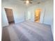 Large bedroom with soft carpeting, multiple closets, and access to a bathroom at 522 Healy Dr # 66, Cumming, GA 30040