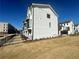 Modern townhome with white brick and a well-maintained lawn at 522 Healy Dr # 66, Cumming, GA 30040